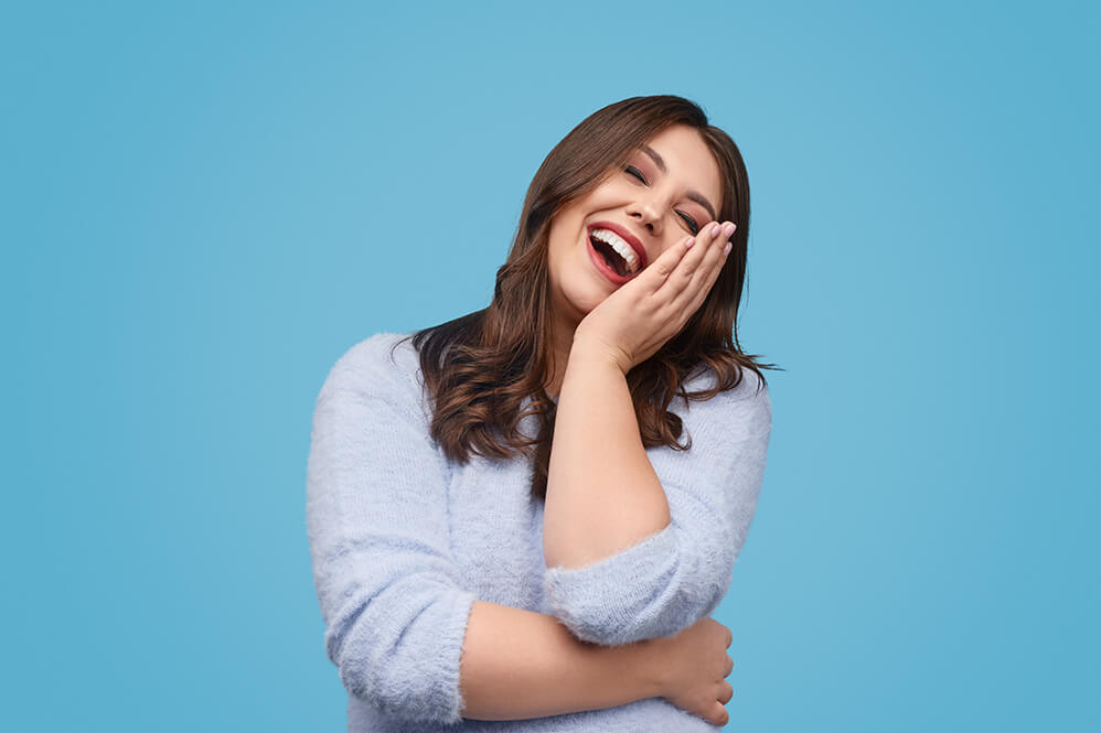 delighted-chubby-woman-laughing