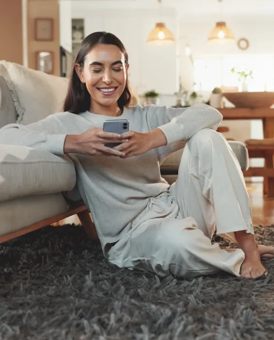 app smile and social media with woman on floor in utc